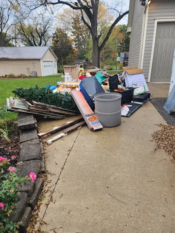 Dumpster being loaded with debris for Roofing Dumpster Rental in South Bay